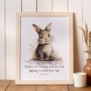 Rabbit nursery print displayed in a bedroom wall frame with Psalm 127:3